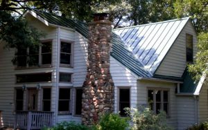 New metal roof on home shaded by trees