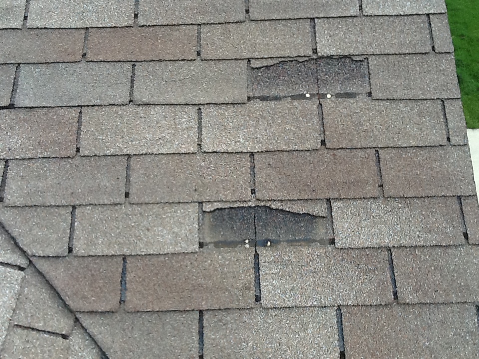 missing shingles on a residential home in Champaign
